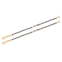Load image into Gallery viewer, Two black beaded bracelets with gold accents on a white background
