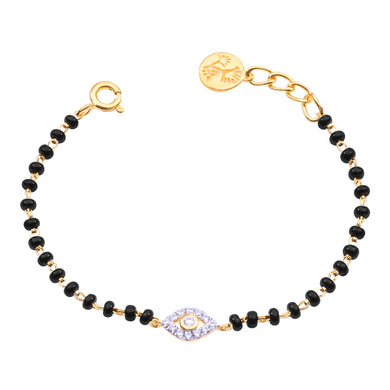 Bracelet with black beads and gold accents on a white background