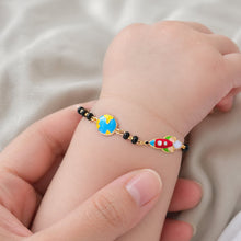 Load image into Gallery viewer, Child's hand wearing a colorful beaded bracelet on a soft fabric background
