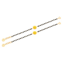 Load image into Gallery viewer, Two bracelets with sun-shaped charms on a white background

