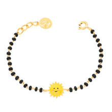 Load image into Gallery viewer, Bracelet with black beads and a yellow sun charm on a white background
