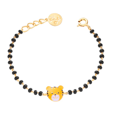 Bracelet with black beads and gold accents on a white background